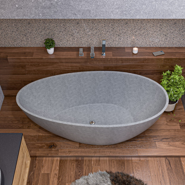 Gray matte concrete tear drop freestanding bathtub as the sculptural centerpiece of a serene bathroom