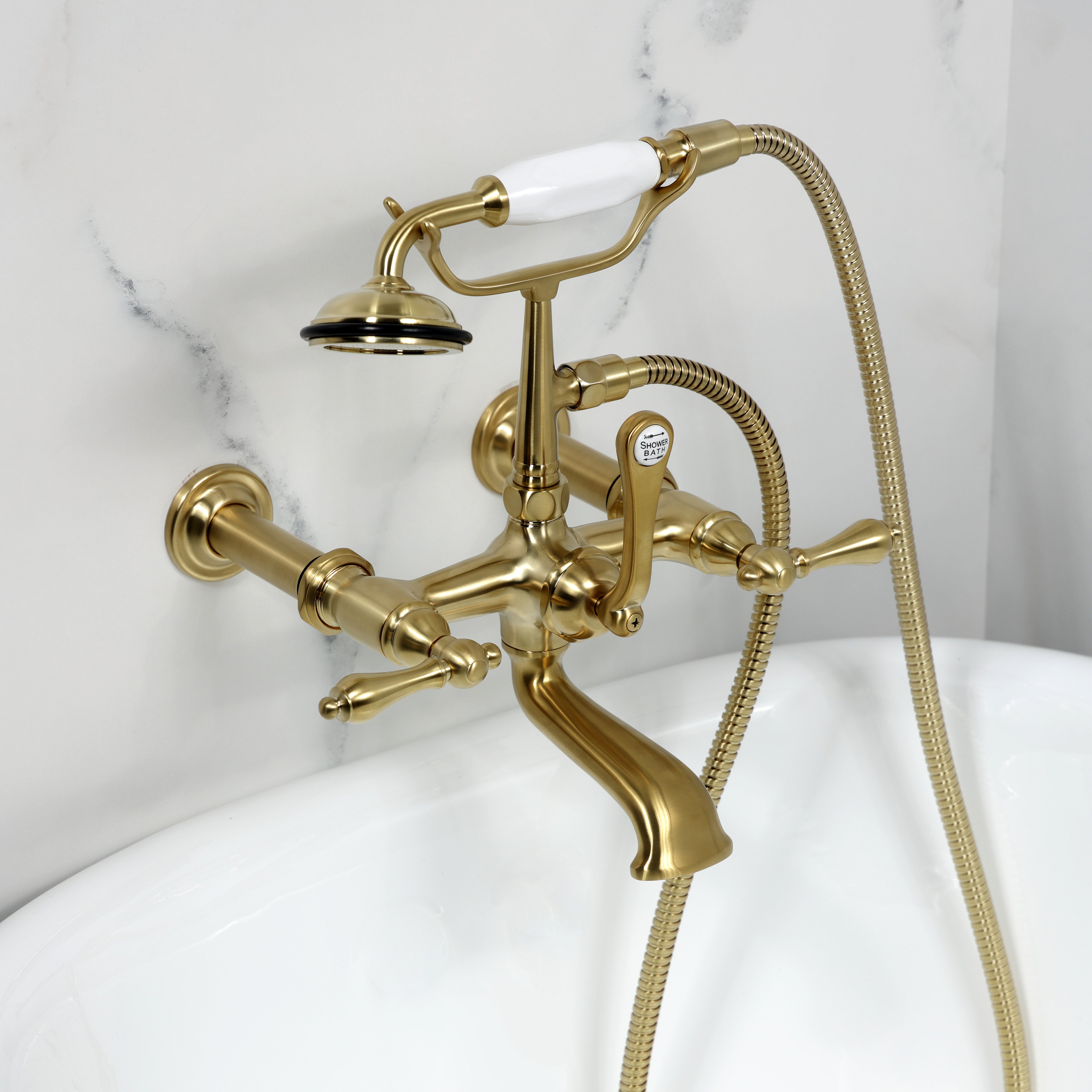 Kingston Brass CC541T7 Vintage 7-Inch Wall Mount Tub Faucet with Hand Shower, Brushed Brass